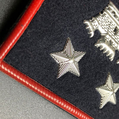 Customizable Clothing Tags Labels with 3D raised lettering embossed by high frequency voltage for tactile branding on matte and fleece surfaces